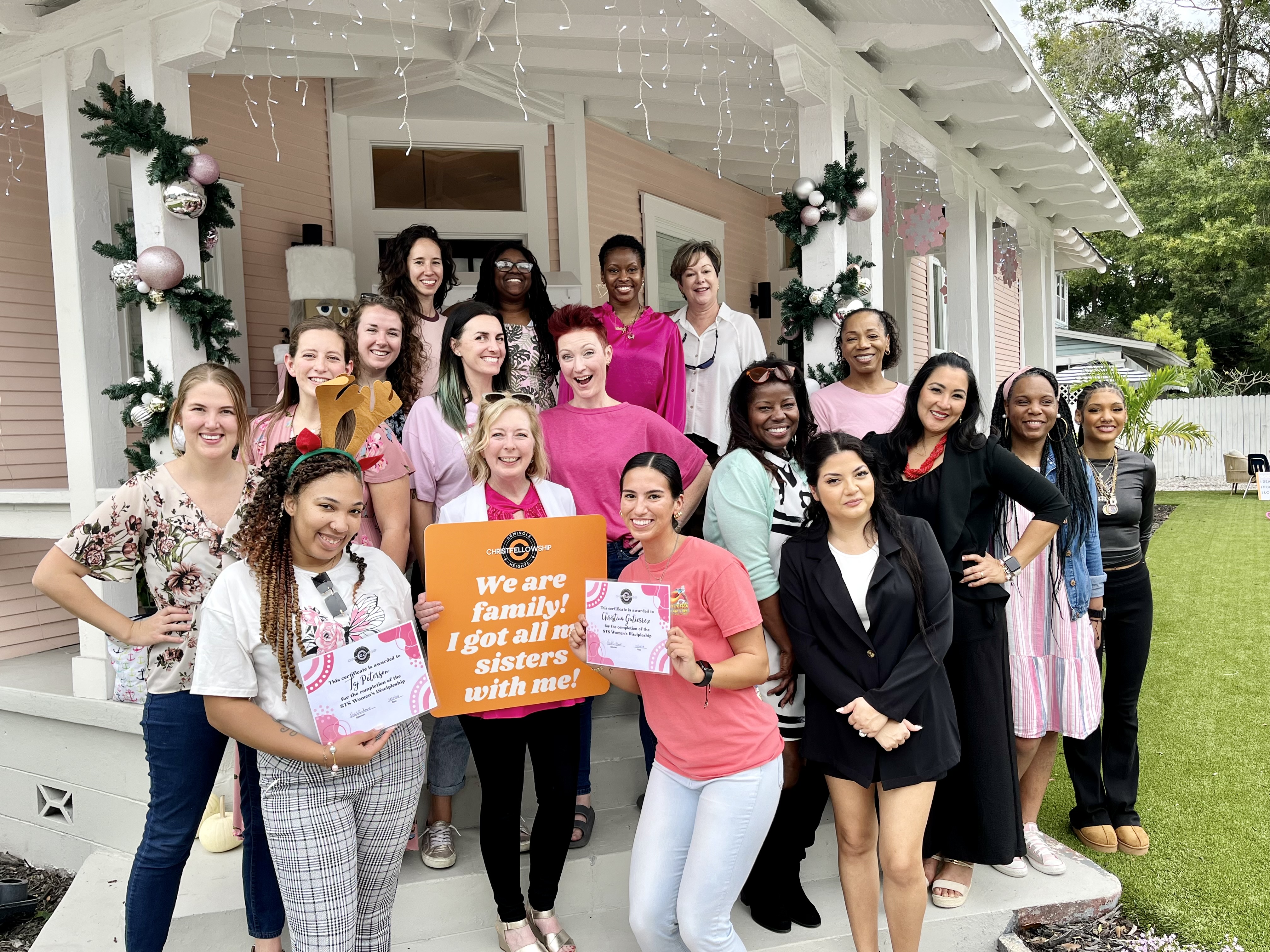 A joyful, multi-generational group of women gathered at a Christ Fellowship discipleship event