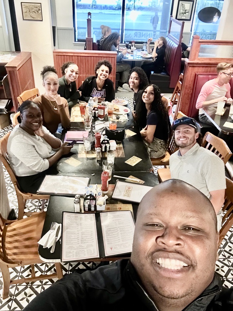 Christ Fellowship college students, young adults, and leaders sharing a meal together